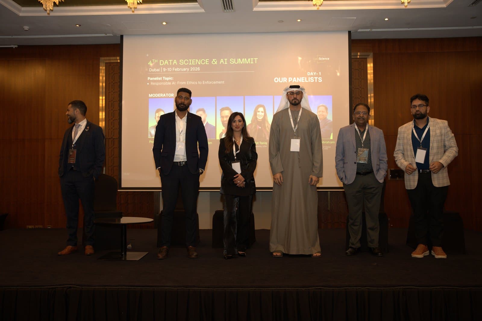 Panelists standing on stage